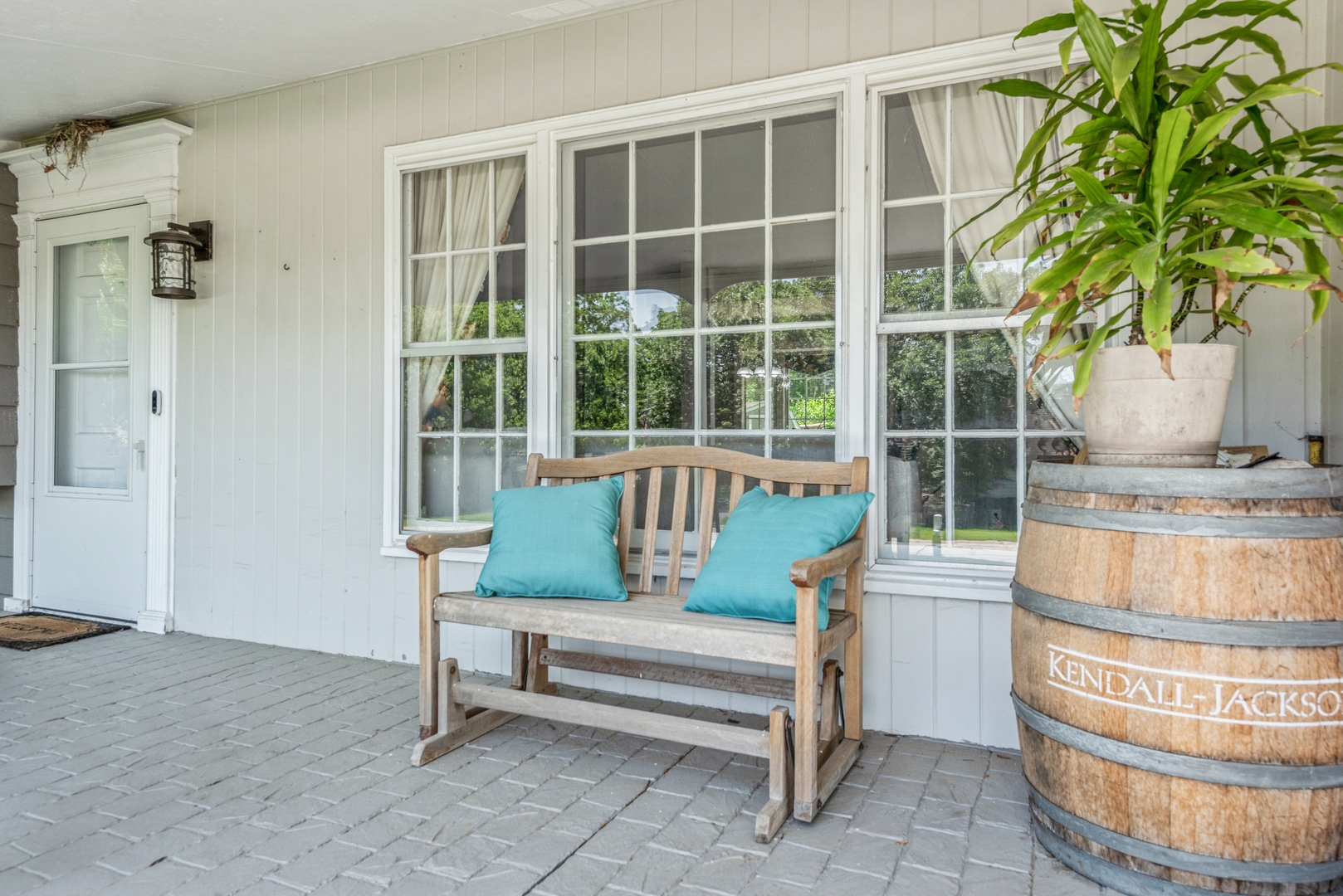 426 High Road Cary, IL 60013 - Photo 3 of 28 a view of a porch with a chairs and a potted plant