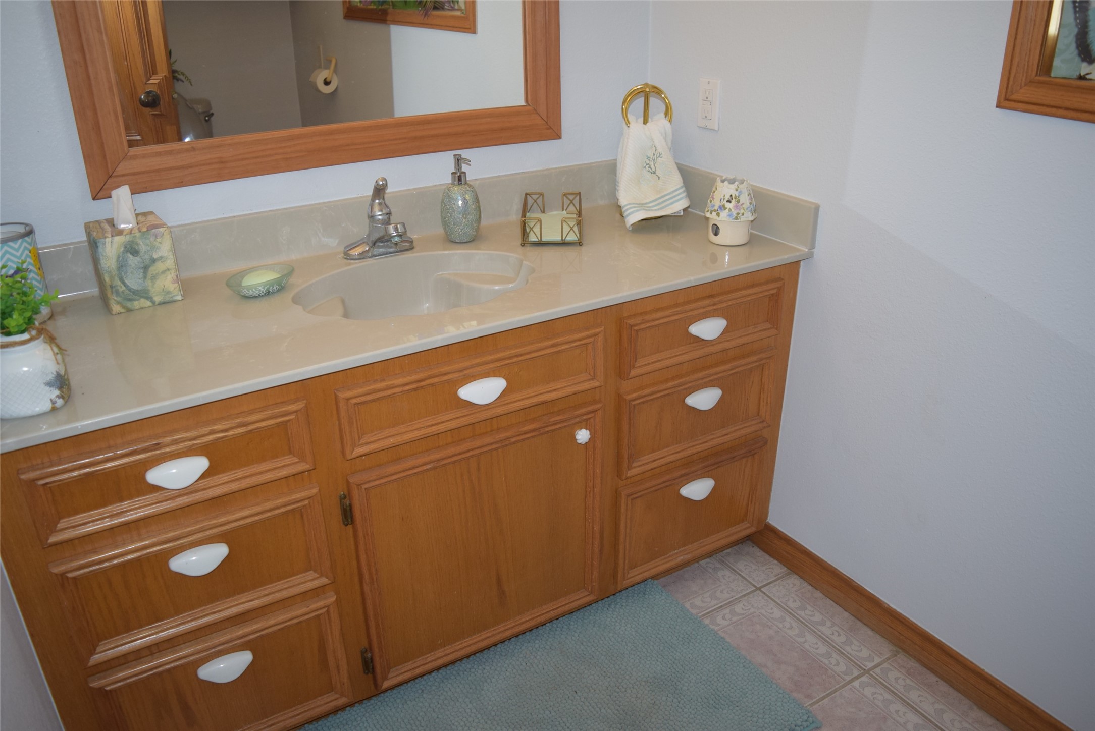 26 Westpoint Drive Trinity, TX 75862 - Photo 38 of 49 a bathroom with a sink and a mirror