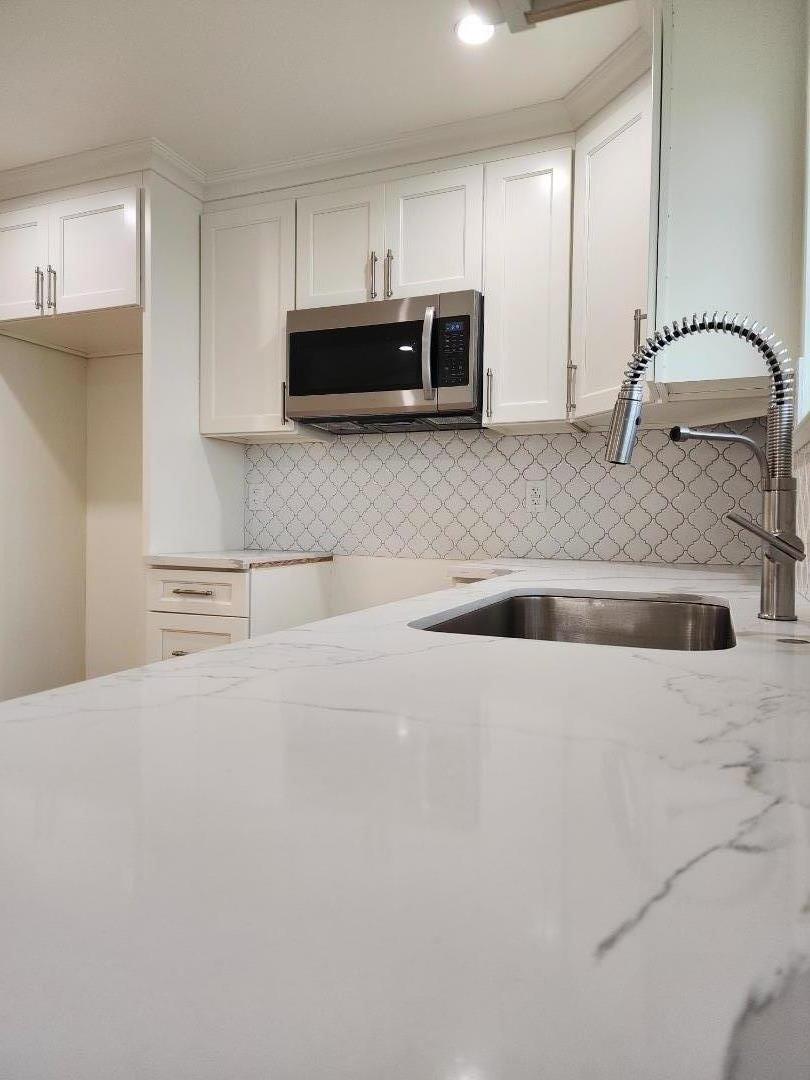 3280 Cheyenne Drive Merced, CA 95348 - Photo 13 of 34 a kitchen with stainless steel appliances granite countertop a refrigerator sink and stove