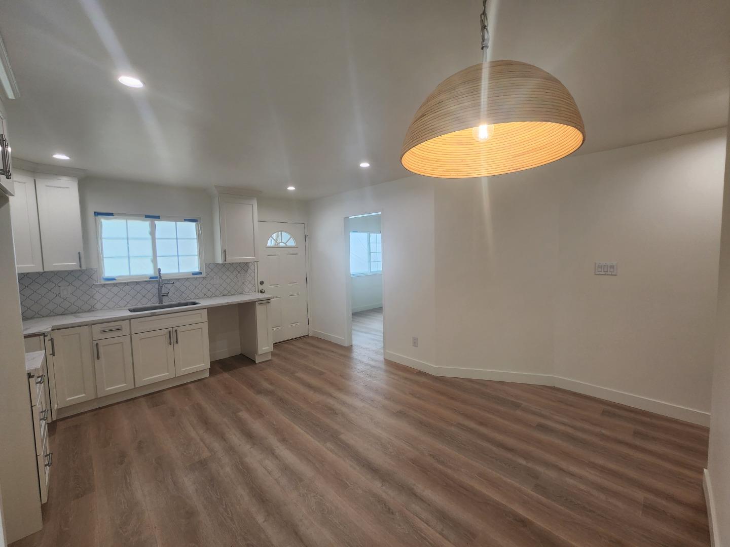 3280 Cheyenne Drive Merced, CA 95348 - Photo 14 of 34 a large kitchen with a lot of counter space and a wooden floor