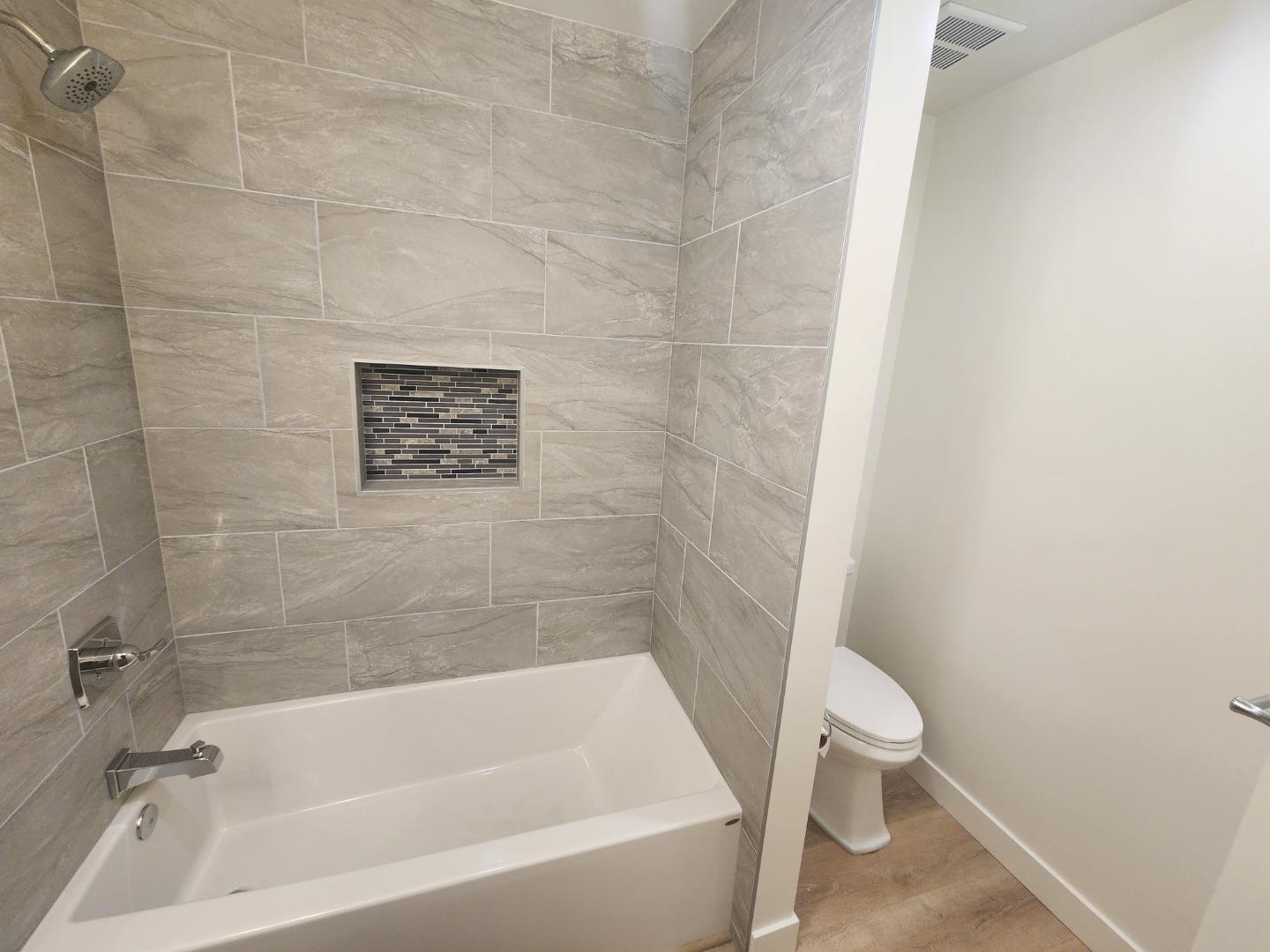 3280 Cheyenne Drive Merced, CA 95348 - Photo 24 of 34 a white bath tub sitting next to a white toilet