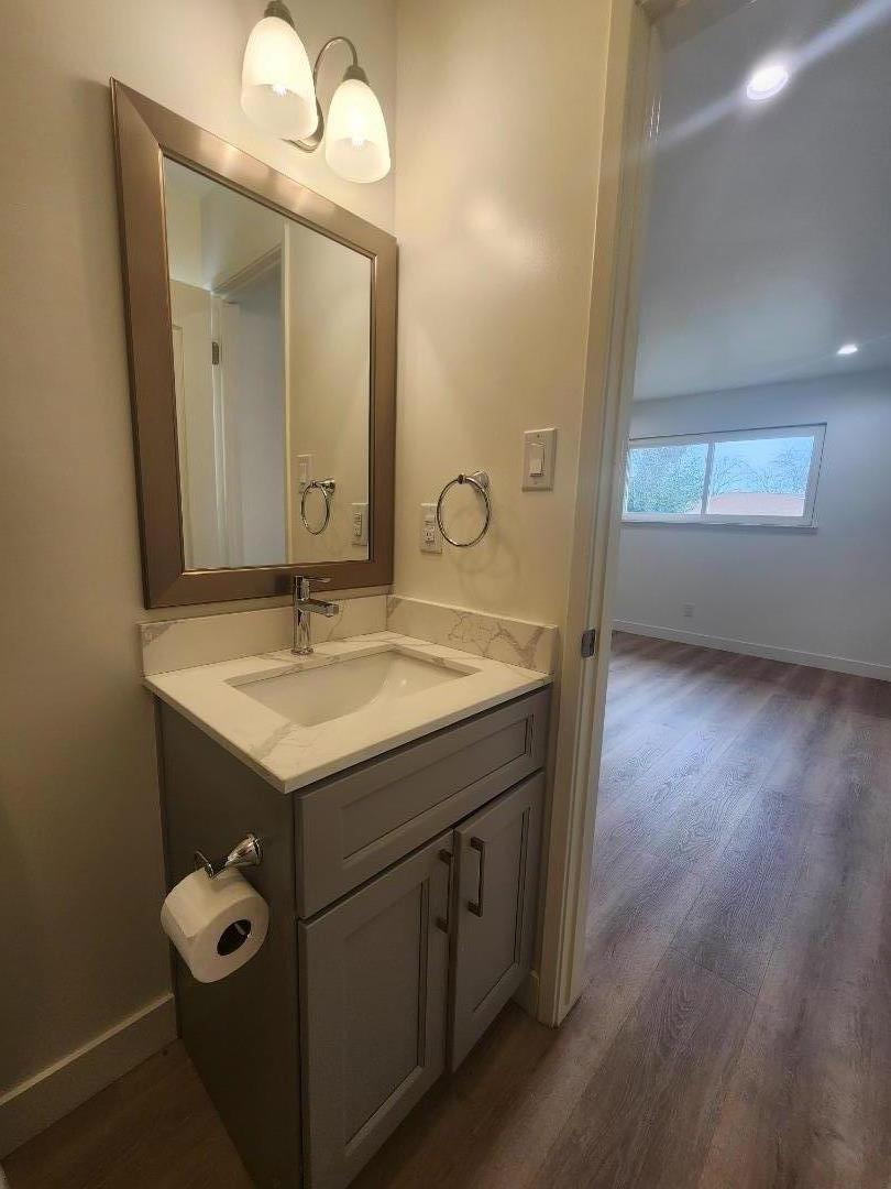 3280 Cheyenne Drive Merced, CA 95348 - Photo 32 of 34 a bathroom with a granite countertop sink a mirror and a vanity
