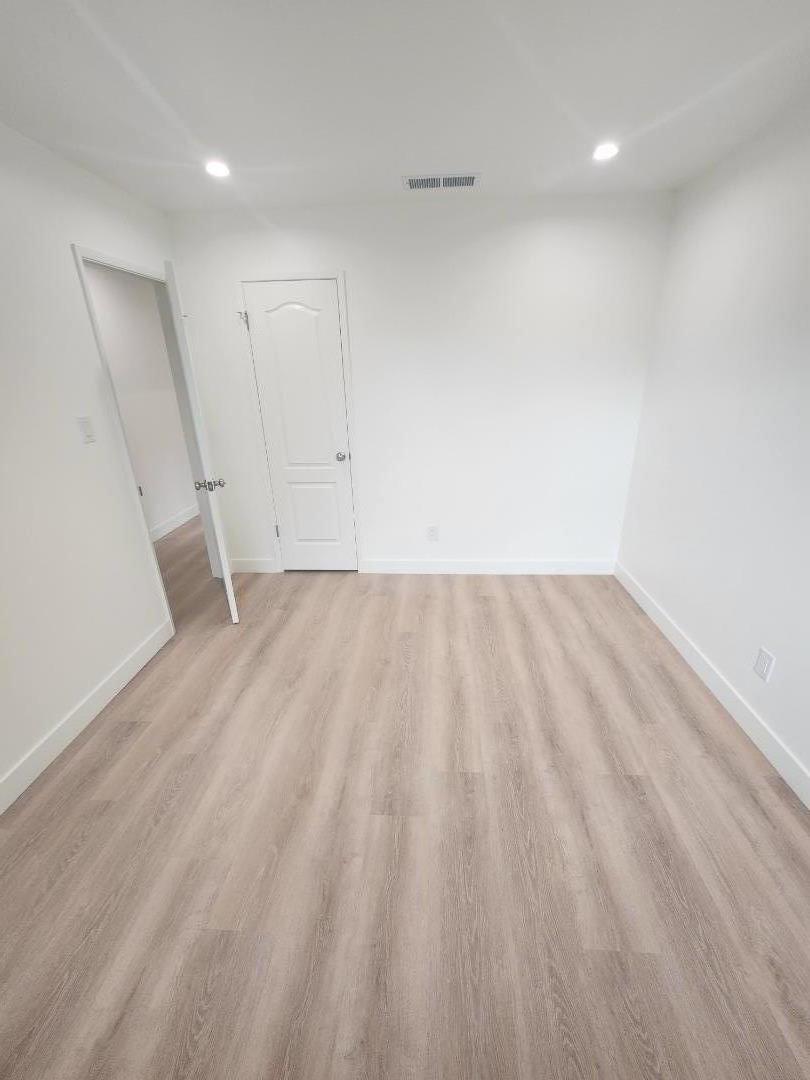 3280 Cheyenne Drive Merced, CA 95348 - Photo 33 of 34 a view of room with wooden floor and white walls