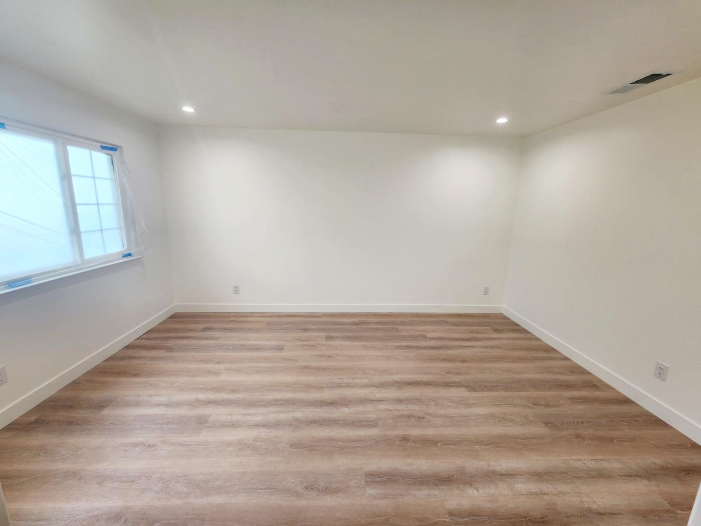 3280 Cheyenne Drive Merced, CA 95348 - Photo 34 of 34 a view of an empty room with wooden floor and a window