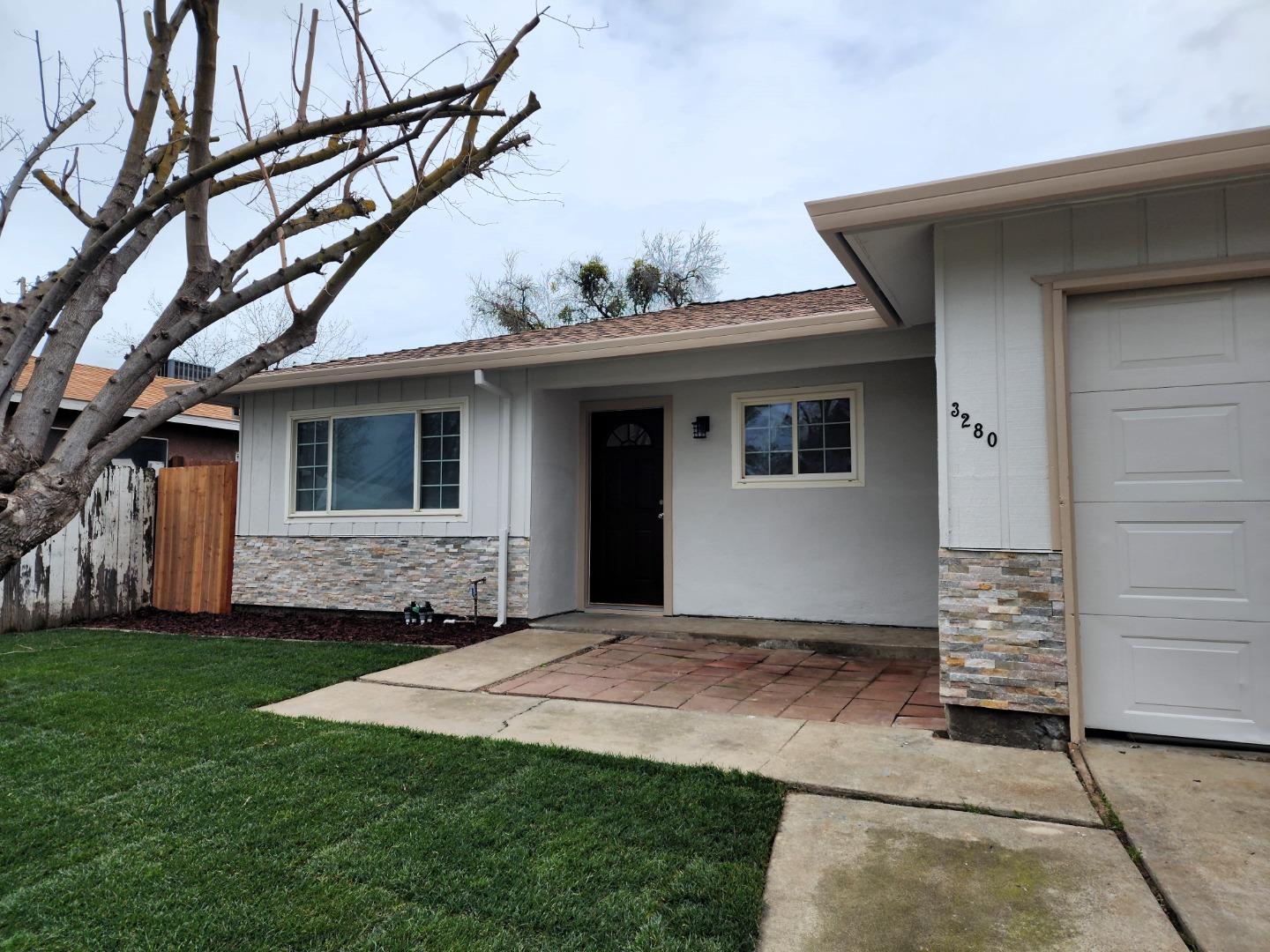 3280 Cheyenne Drive Merced, CA 95348 - Photo 4 of 34 a front view of a house with a yard