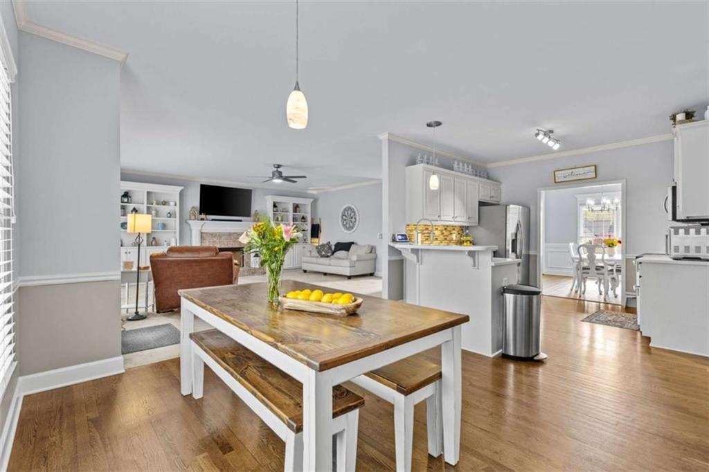 1148 Maple Creek Ridge Loganville, GA 30052 - Photo 14 of 46 a view of kitchen with cabinets table and chairs