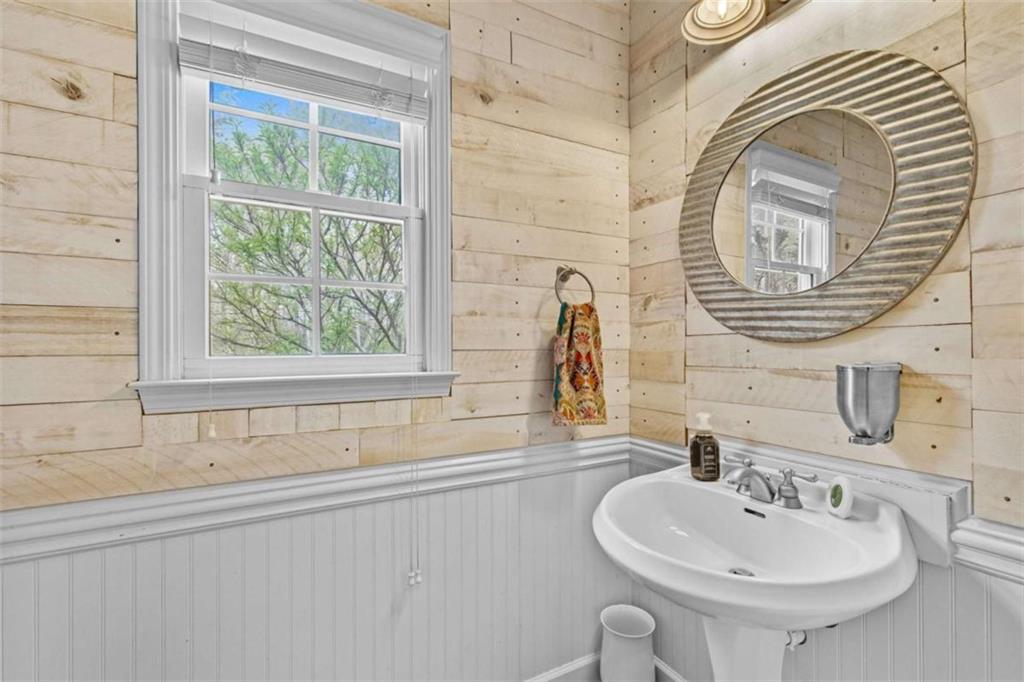 1148 Maple Creek Ridge Loganville, GA 30052 - Photo 19 of 46 a bathroom with a sink and a mirror