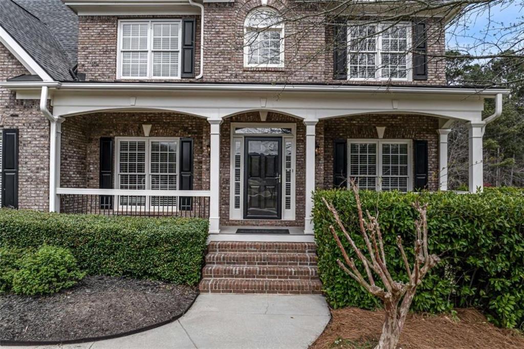 1148 Maple Creek Ridge Loganville, GA 30052 - Photo 2 of 46 front view of a building