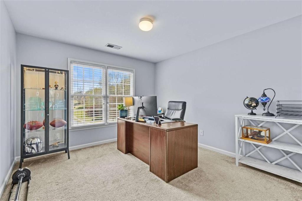 1148 Maple Creek Ridge Loganville, GA 30052 - Photo 25 of 46 a workspace with furniture and window