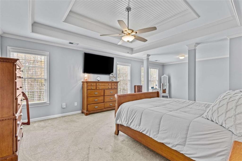 1148 Maple Creek Ridge Loganville, GA 30052 - Photo 27 of 46 a bedroom with a bed and a flat screen tv