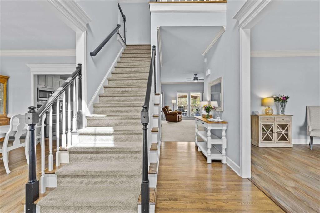 1148 Maple Creek Ridge Loganville, GA 30052 - Photo 3 of 46 a view of entryway and hall with wooden floor