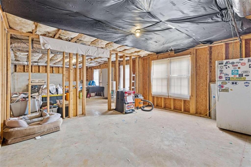 1148 Maple Creek Ridge Loganville, GA 30052 - Photo 38 of 46 a view of a room with gym equipment