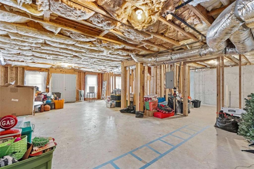 1148 Maple Creek Ridge Loganville, GA 30052 - Photo 40 of 46 a view of a room with gym equipment