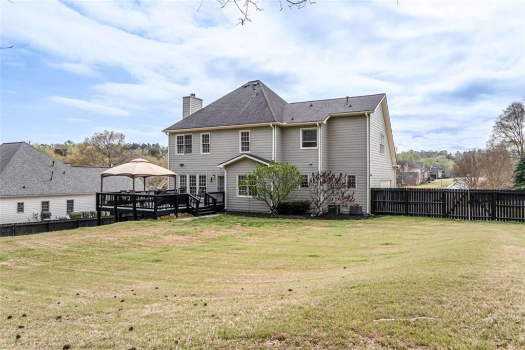 1148 Maple Creek Ridge Loganville, GA 30052 - Photo 45 of 46 a front view of a house with a yard