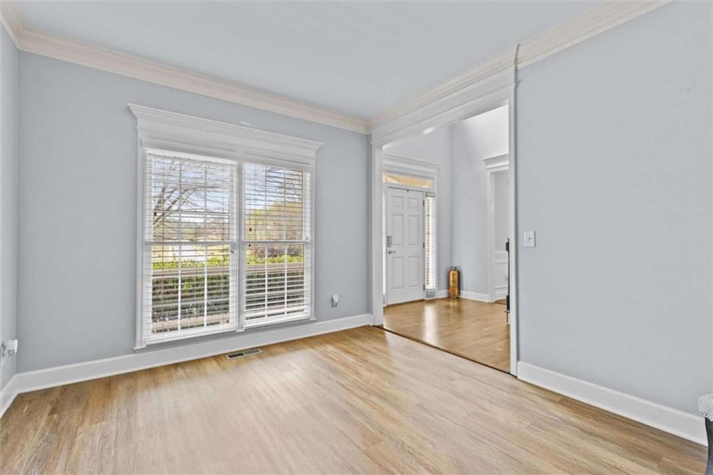 1148 Maple Creek Ridge Loganville, GA 30052 - Photo 6 of 46 a view of wooden floor and cabinet in a room