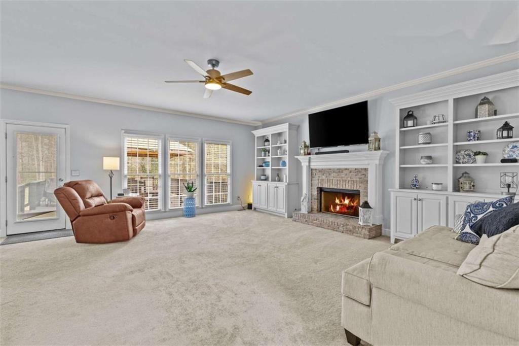 1148 Maple Creek Ridge Loganville, GA 30052 - Photo 9 of 46 a living room with furniture or fireplace and a flat screen tv