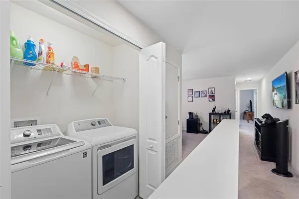 a bathroom with a granite countertop sink mirror vanity and toilet