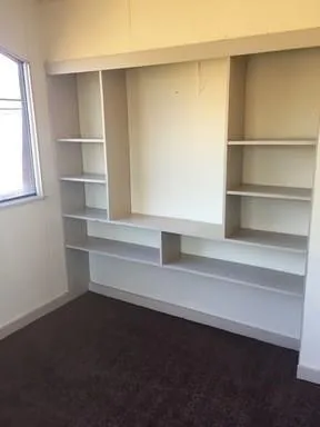 a view of an empty walk in closet