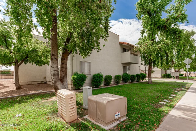 a view of a house with backyard sitting area and garden