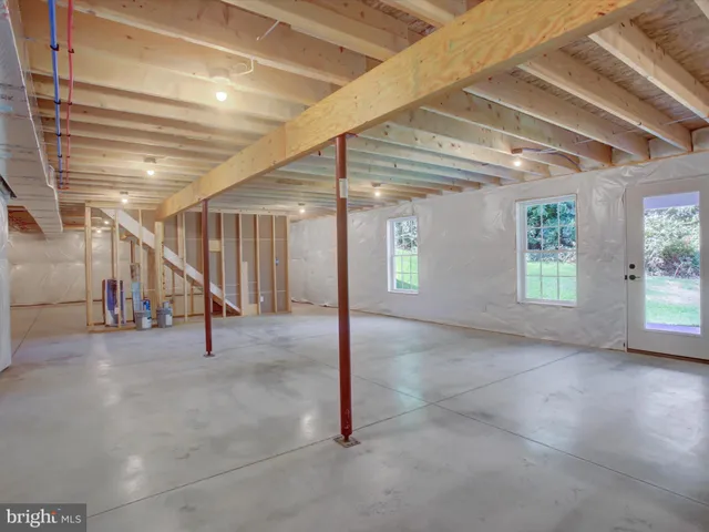 a view of an empty room with windows