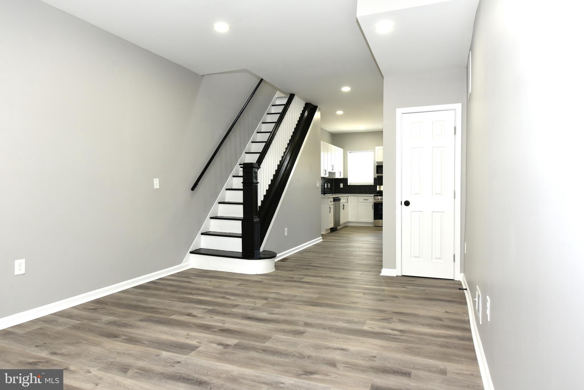 2225 West Baltimore Street Baltimore, MD 21223 - Photo 3 of 46 a view of entryway and hall with wooden floor