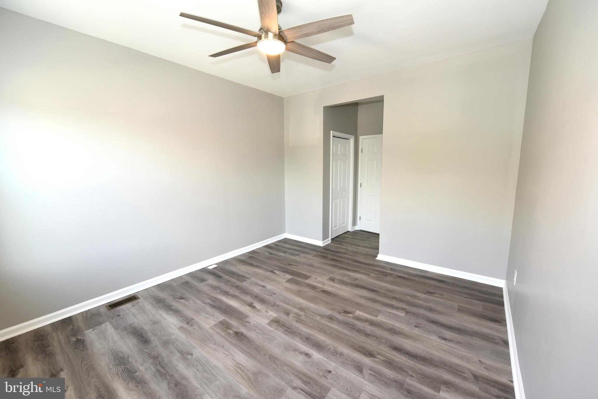 2225 West Baltimore Street Baltimore, MD 21223 - Photo 31 of 46 a view of empty room with wooden floor