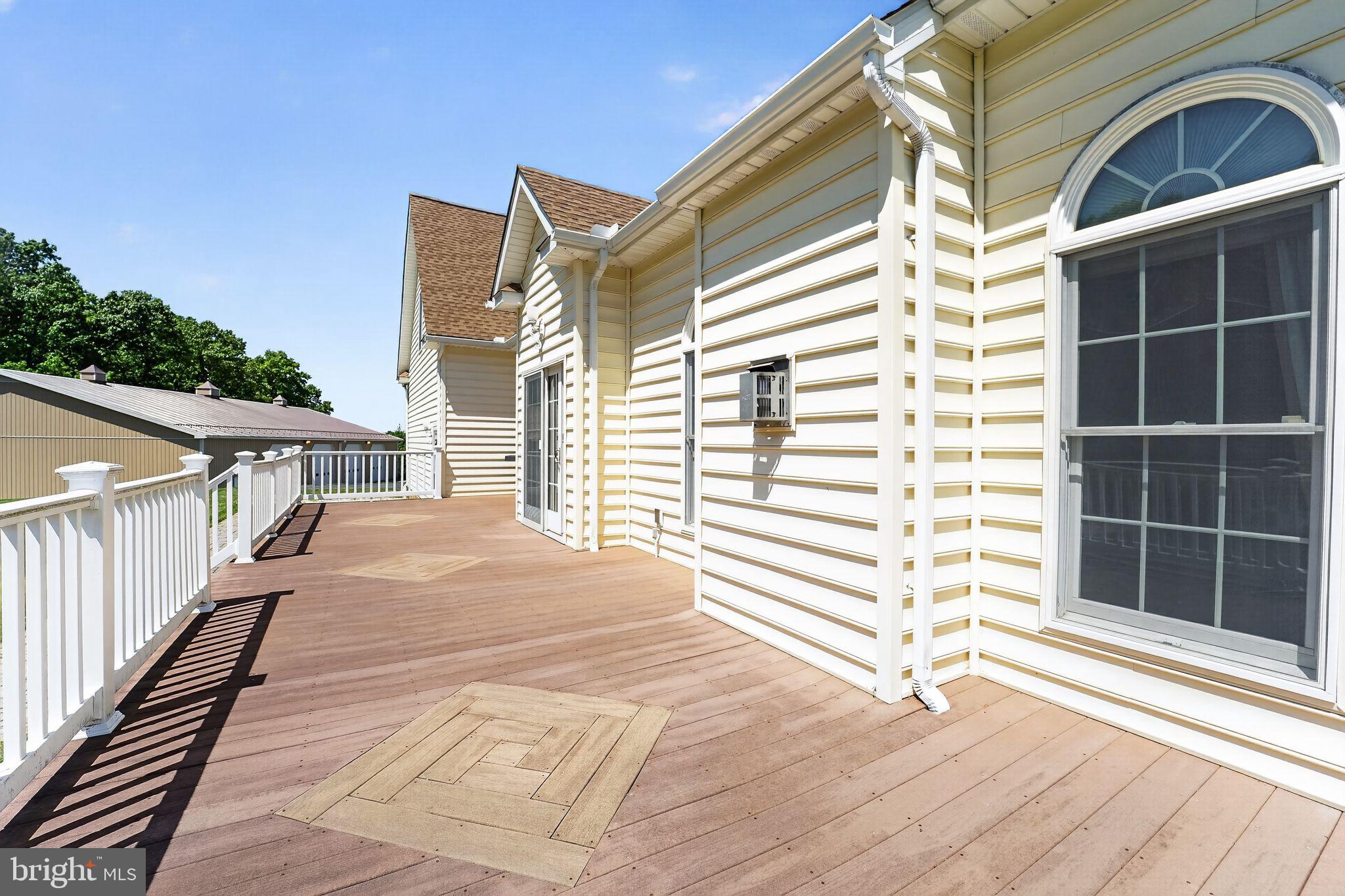 1165 Line Road Westminster, MD 21158 - Photo 55 of 75 a view of a balcony with a floor to ceiling window and wooden floor