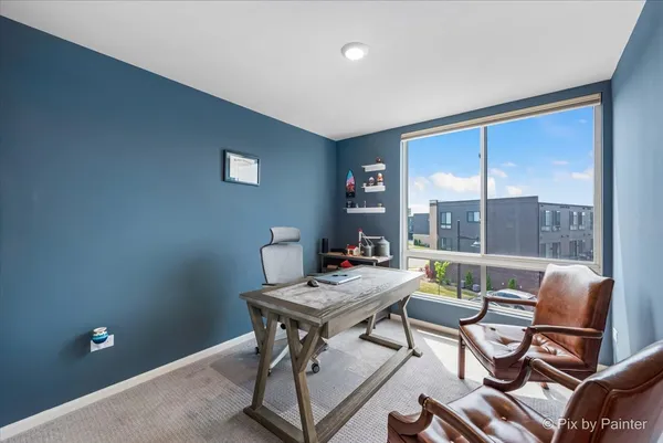 a workspace with furniture and window
