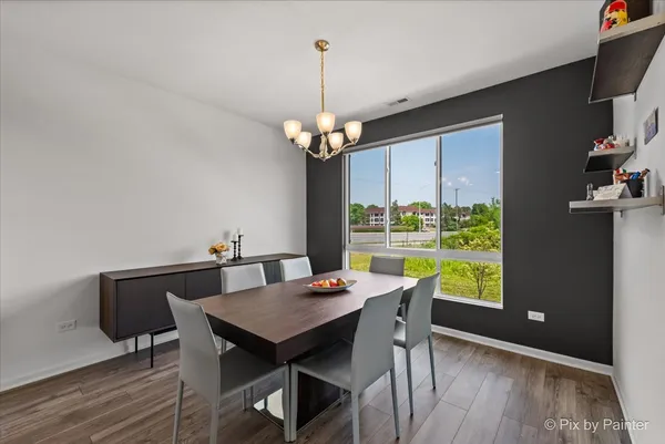 a view of a dining room with furniture window and outside view