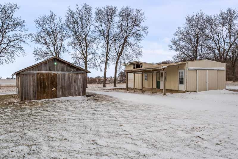 8611 Huber Road Belvidere, IL 61008 - Photo 21 of 79 a front view of a house with a yard and garage