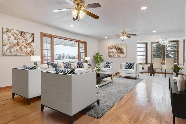 a kitchen with stainless steel appliances granite countertop a refrigerator a sink and a stove