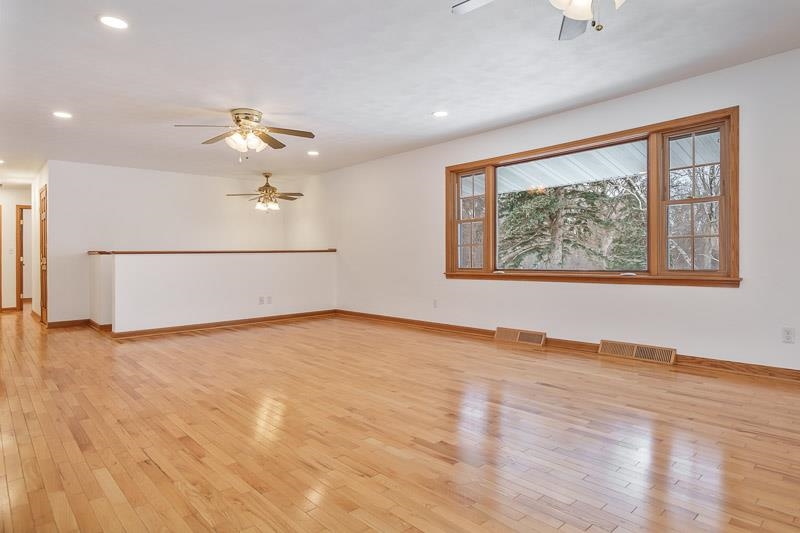 8611 Huber Road Belvidere, IL 61008 - Photo 30 of 79 wooden floor in an empty room with a window