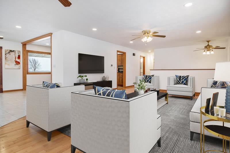 8611 Huber Road Belvidere, IL 61008 - Photo 32 of 79 a living room with furniture and a flat screen tv