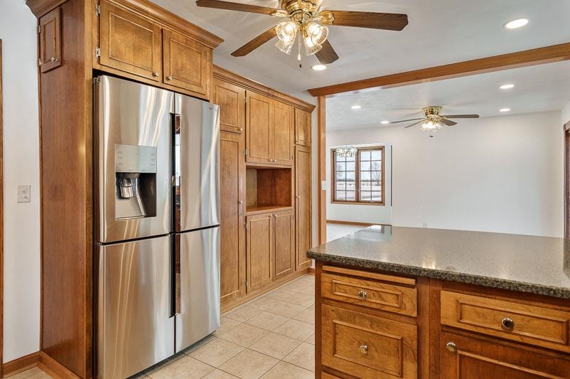 8611 Huber Road Belvidere, IL 61008 - Photo 43 of 79 a kitchen with stainless steel appliances granite countertop a refrigerator and microwave