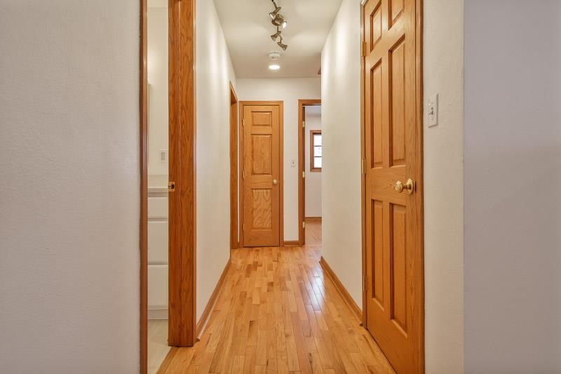 8611 Huber Road Belvidere, IL 61008 - Photo 45 of 79 a view of a hallway with wooden floor and staircase