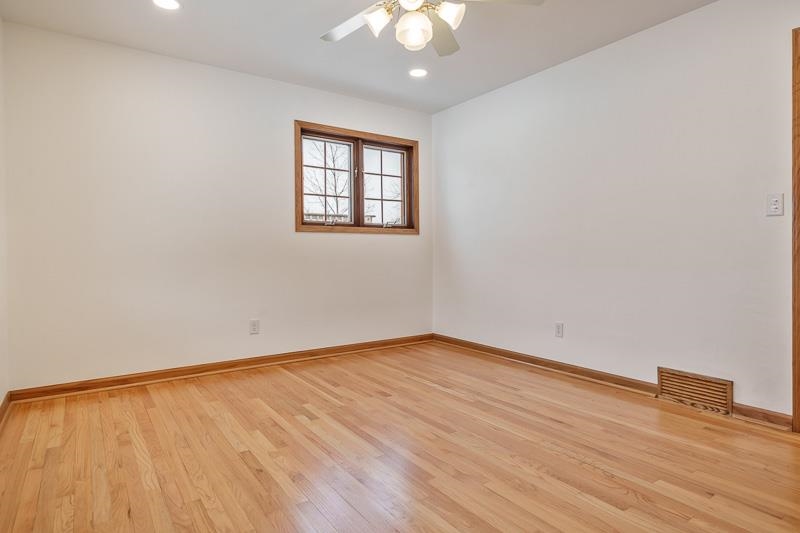8611 Huber Road Belvidere, IL 61008 - Photo 50 of 79 wooden floor in an empty room with a window