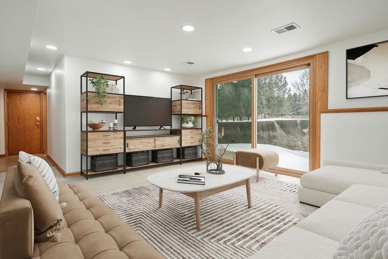 8611 Huber Road Belvidere, IL 61008 - Photo 65 of 79 a living room with furniture a flat screen tv and a large window