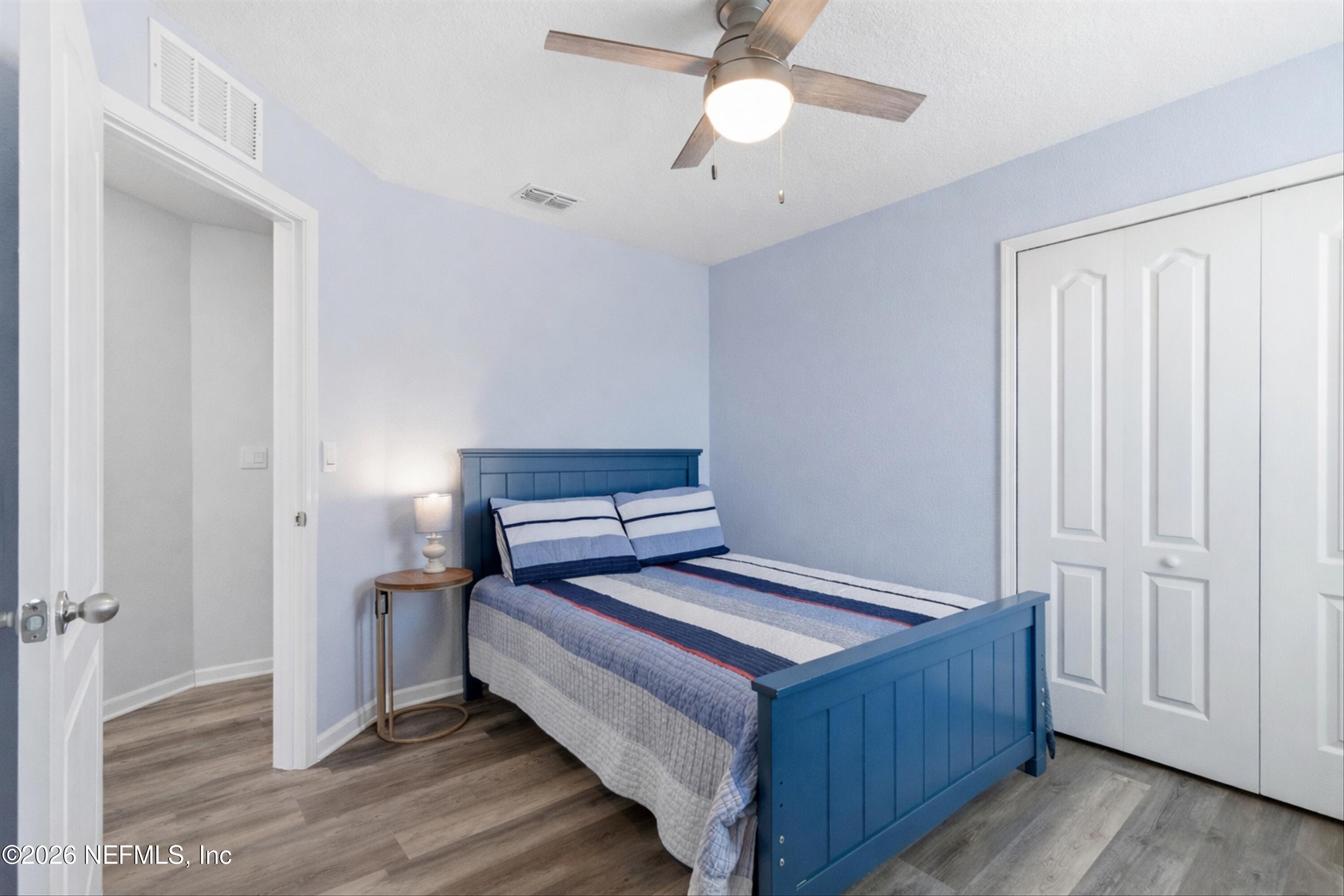 103 Seaport Breeze Road St. Augustine, FL 32095 - Photo 22 of 44 a bedroom with bed and wooden floor
