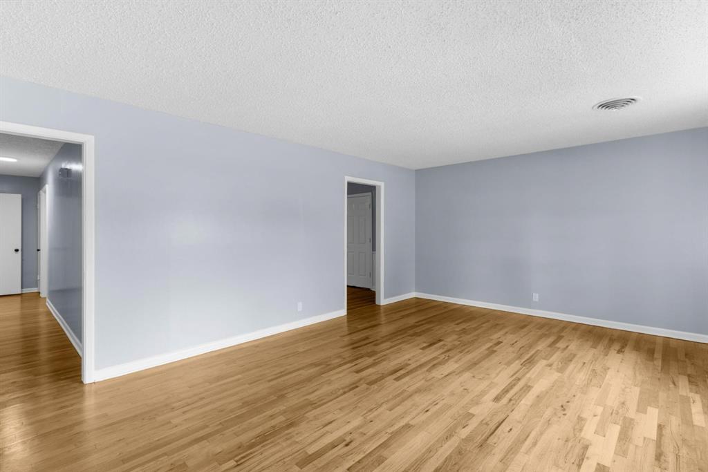 1818 Belden Street Sherman, TX 75092 - Photo 17 of 28 a view of an empty room and wooden floor