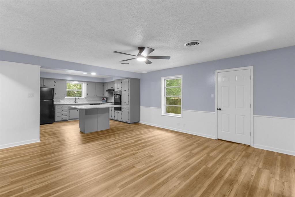 1818 Belden Street Sherman, TX 75092 - Photo 20 of 28 a view of kitchen with wooden floor and window
