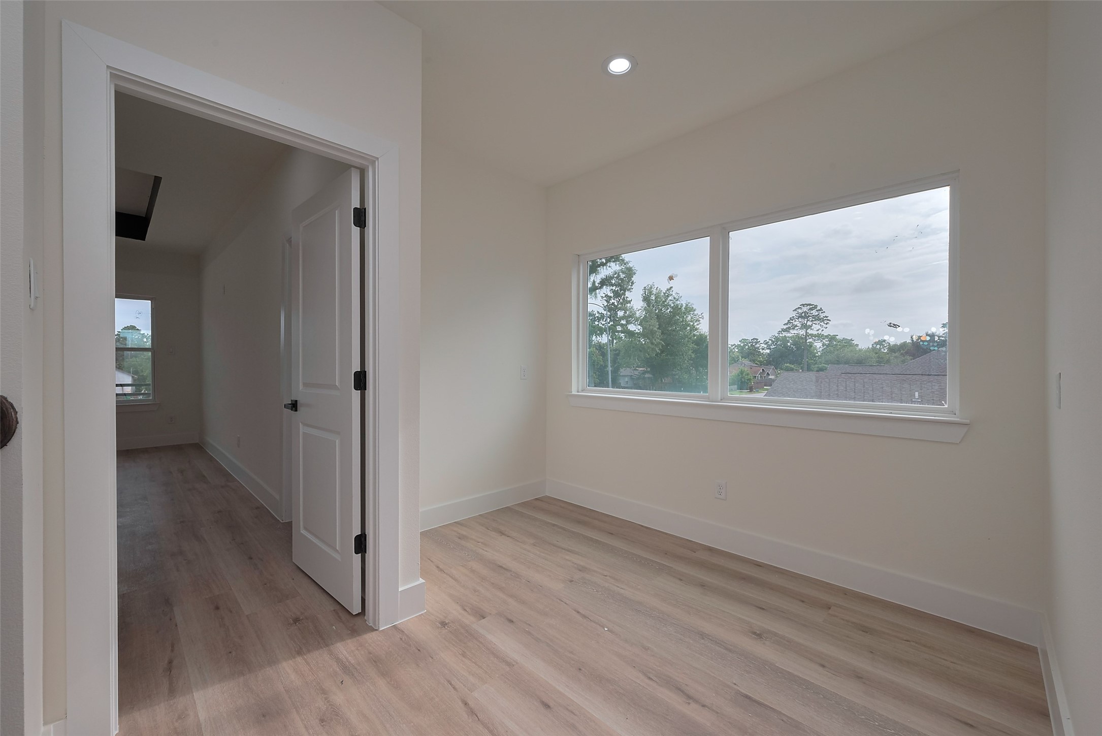 2422 Dalview Street Houston, TX 77091 - Photo 10 of 24 The second floor landing offers a
bright and airy space, thanks to large
windows that flood the area with
natural light—ideal for a study nook,
plant corner, or quiet lounge zone.