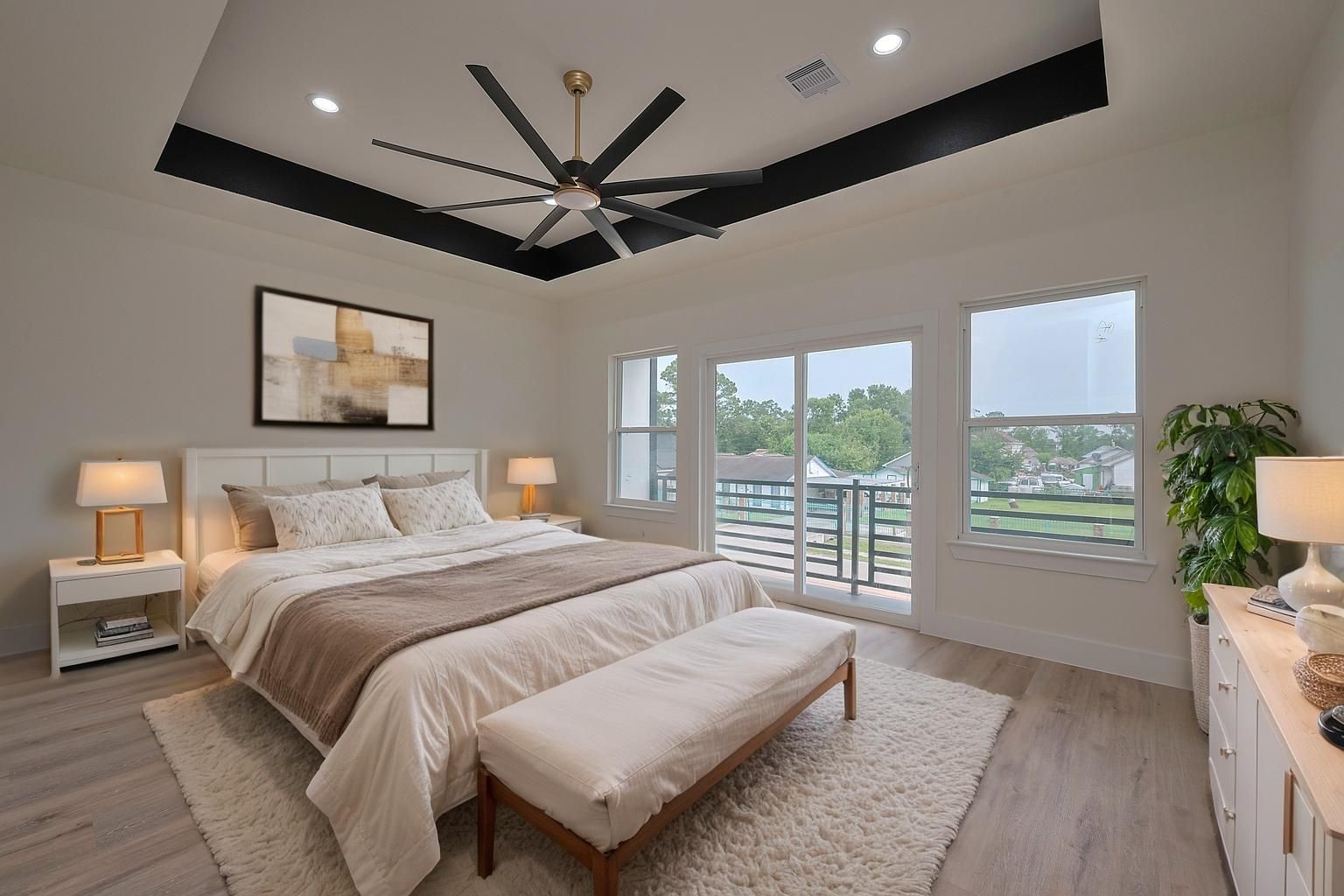 2422 Dalview Street Houston, TX 77091 - Photo 12 of 24 Retreat to your personal sanctuary in
the oversized primary bedroom,
highlighted by massive windows and
private balcony access, making it the
perfect space to relax or recharge. -
This room has been virtually staged.