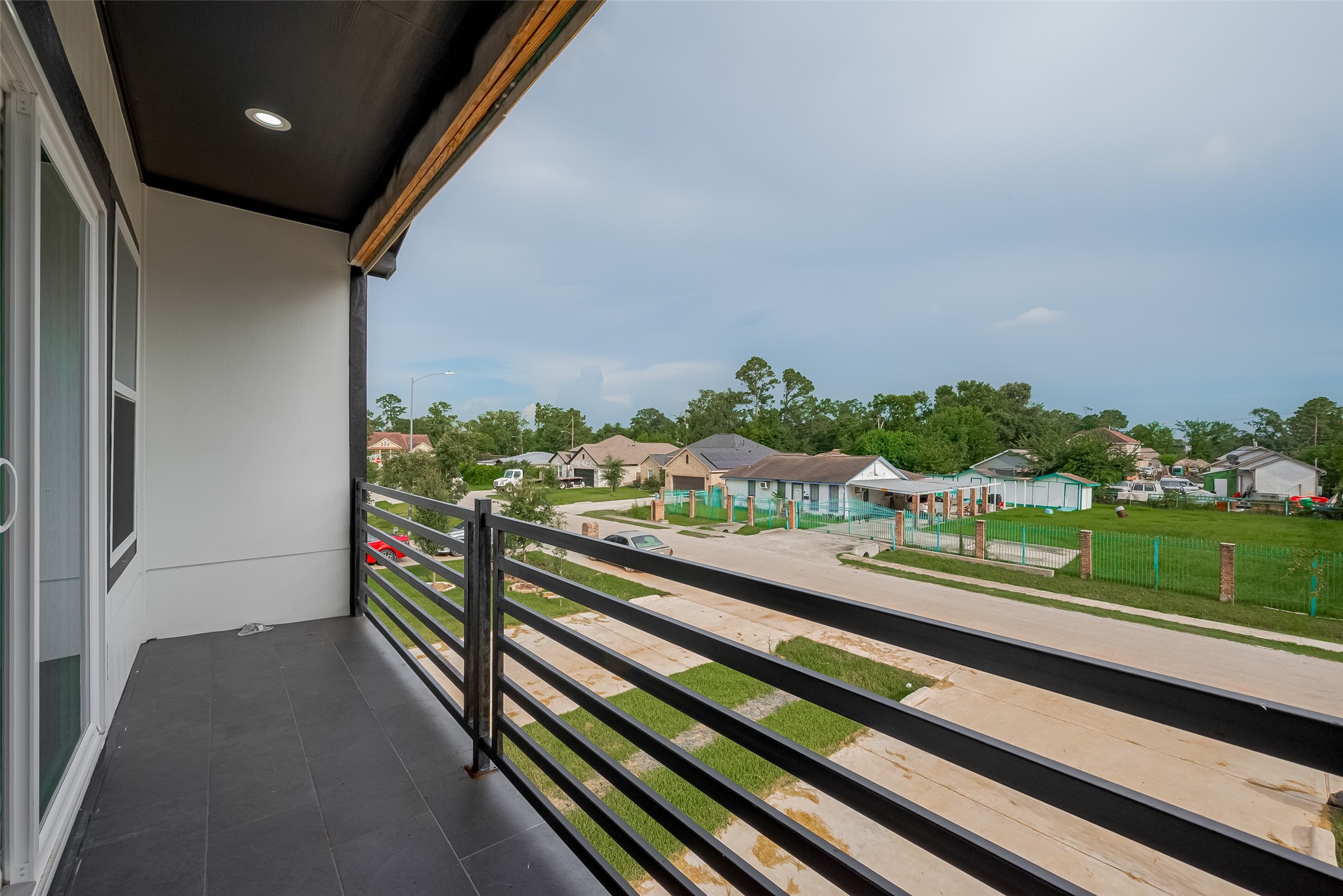 2422 Dalview Street Houston, TX 77091 - Photo 17 of 24 Wake up and step right out onto your
private balcony—accessible directly
from the primary bedroom.