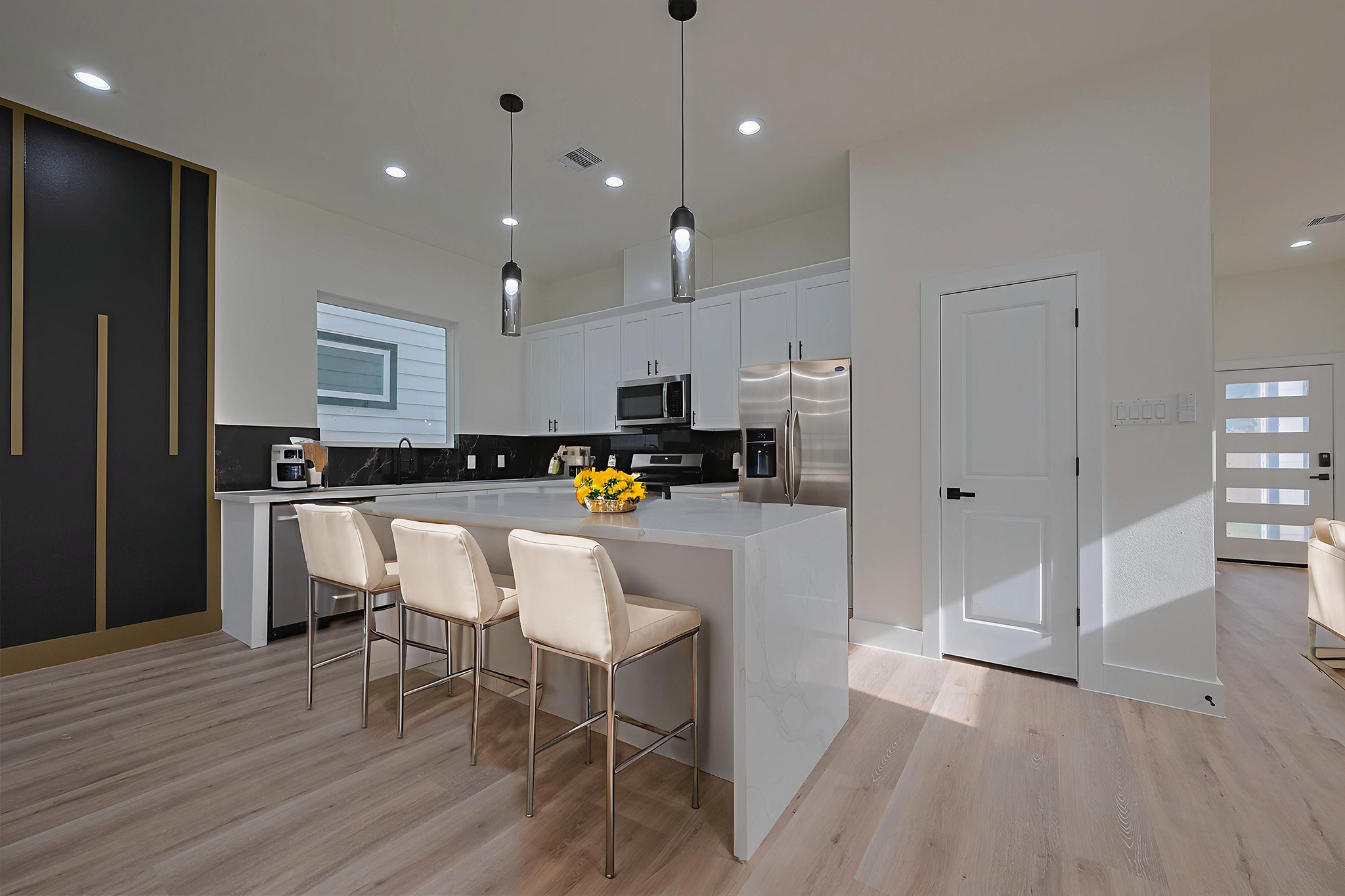 2422 Dalview Street Houston, TX 77091 - Photo 6 of 24 The stunning kitchen island serves
as both a prep space and a casual
dining nook. With waterfall-style
sides and a clean quartz countertop,
it’s perfect for quick breakfasts,
evening cocktails, or late-night
snacks with friends. - This room has
been virtually staged.