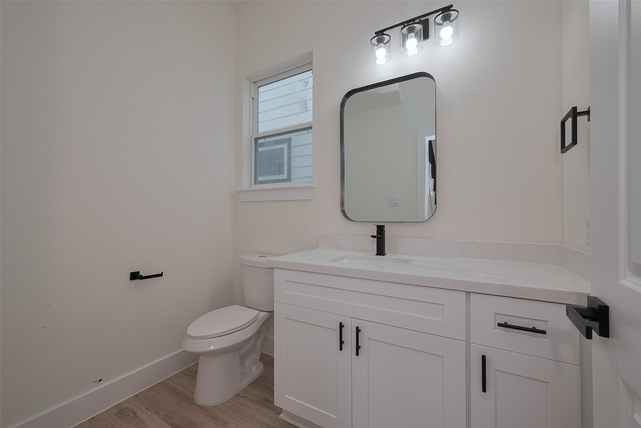 2422 Dalview Street Houston, TX 77091 - Photo 9 of 24 Perfect for guests, the first-floor half
bathroom features a modern design
with sleek fixtures and easy access
from the main living areas—
combining style and convenience for
everyday living.