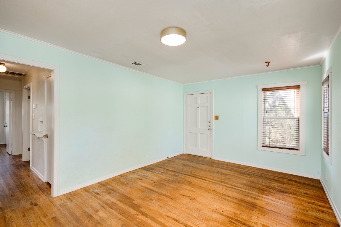 4804 Tanney Street Austin, TX 78721 - Photo 17 of 35 a view of empty room with wooden floor and fan