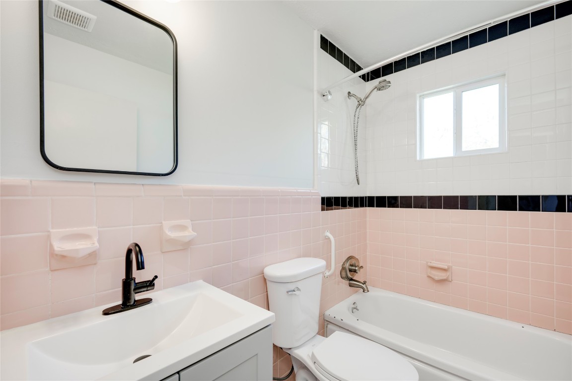 4804 Tanney Street Austin, TX 78721 - Photo 25 of 35 a bathroom with a sink toilet and shower