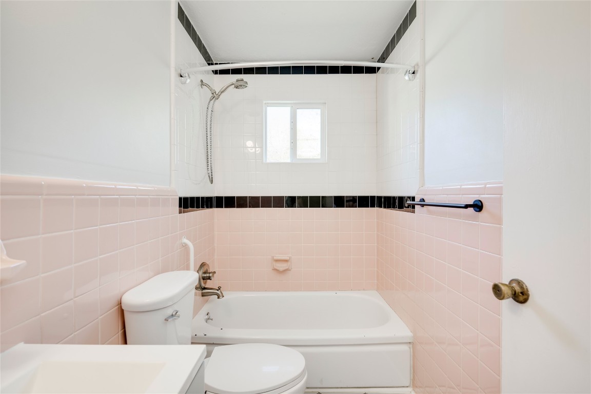 4804 Tanney Street Austin, TX 78721 - Photo 26 of 35 a bathroom with a toilet and a shower