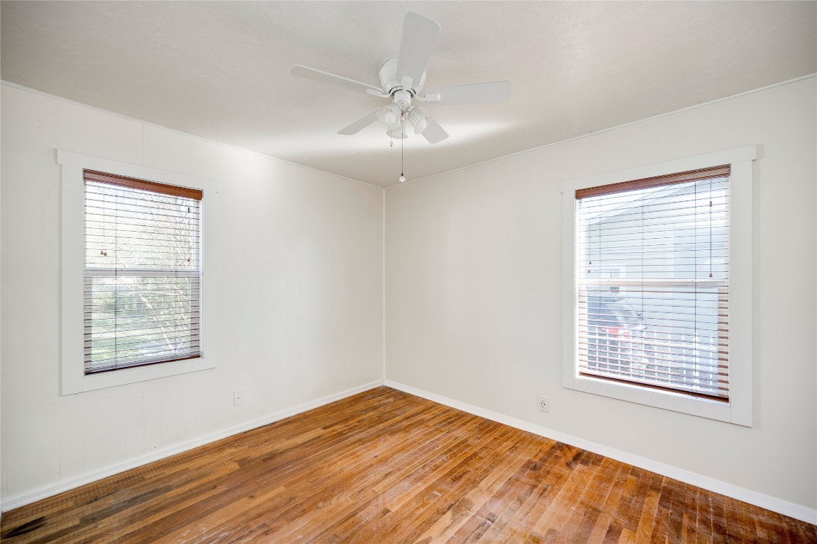 4804 Tanney Street Austin, TX 78721 - Photo 27 of 35 a view of an empty room with wooden floor and a window