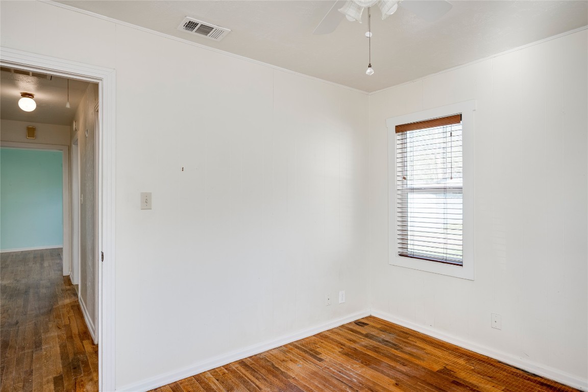 4804 Tanney Street Austin, TX 78721 - Photo 30 of 35 a view of a room with wooden floor and windows